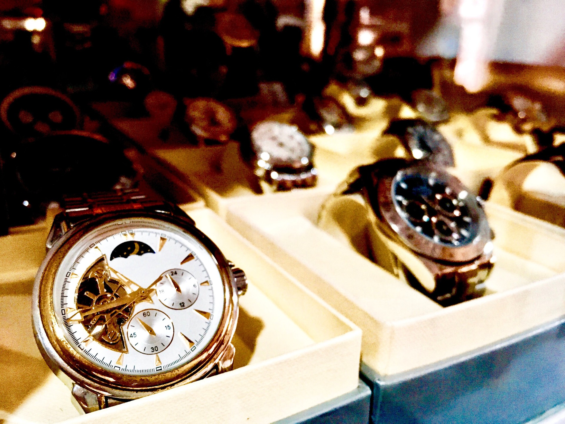 Collection of Luxury Wristwatches in Glass Cabinet